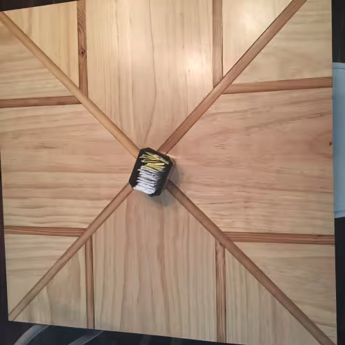Laminated wood tabletop at Nola